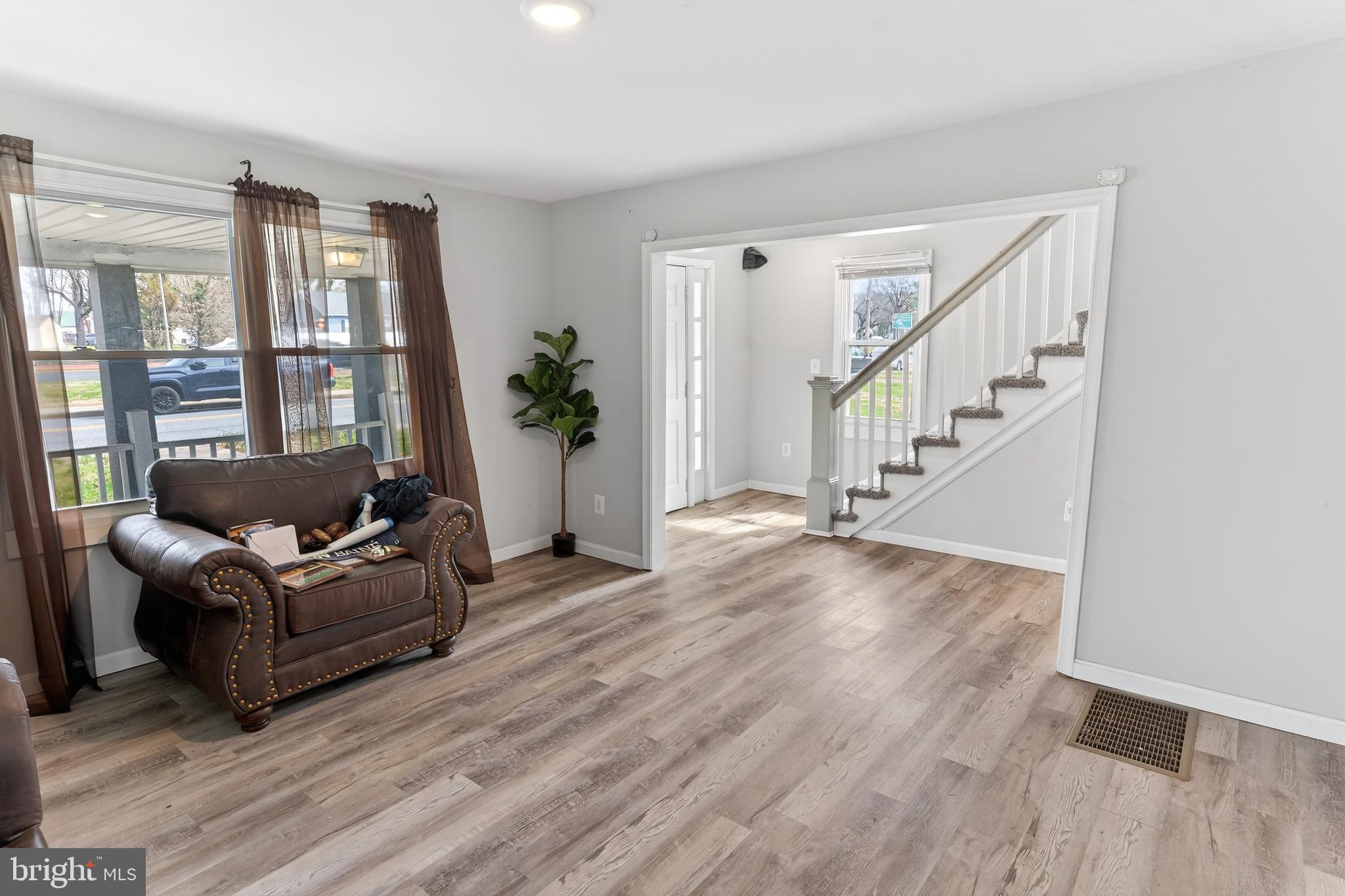 1002 West Main Street Salisbury, MD 21801 - Photo 9 of 31 a living room with furniture and wooden floor