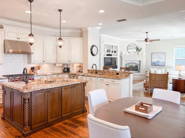 a kitchen with a table chairs and microwave
