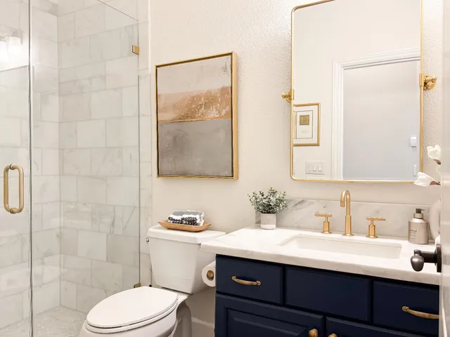 a bedroom with a bed chair and window