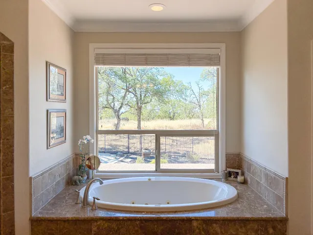 a bedroom with furniture and a flat screen tv