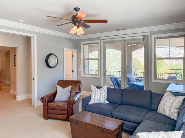 a swimming pool with outdoor seating and yard