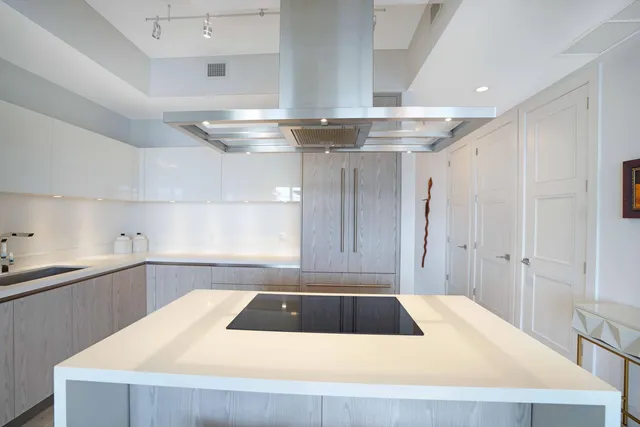 a kitchen with a sink cabinets and window