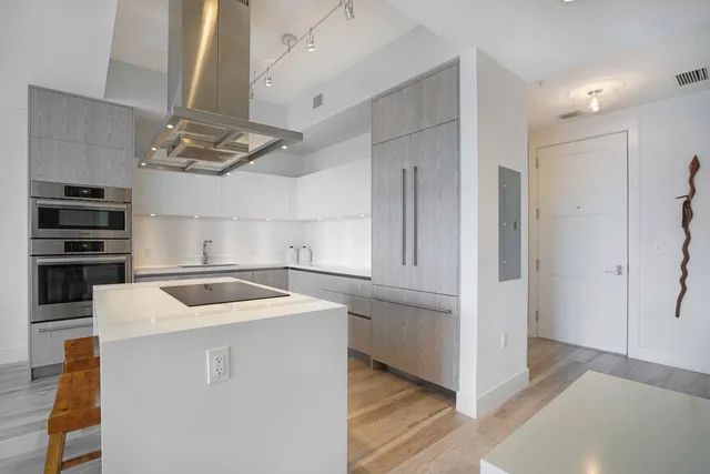 a kitchen that has a microwave and a stove