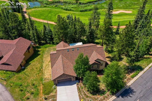 an aerial view of a house with a garden