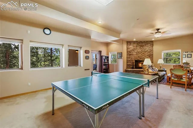 an open kitchen with stainless steel appliances granite countertop a sink window and chairs