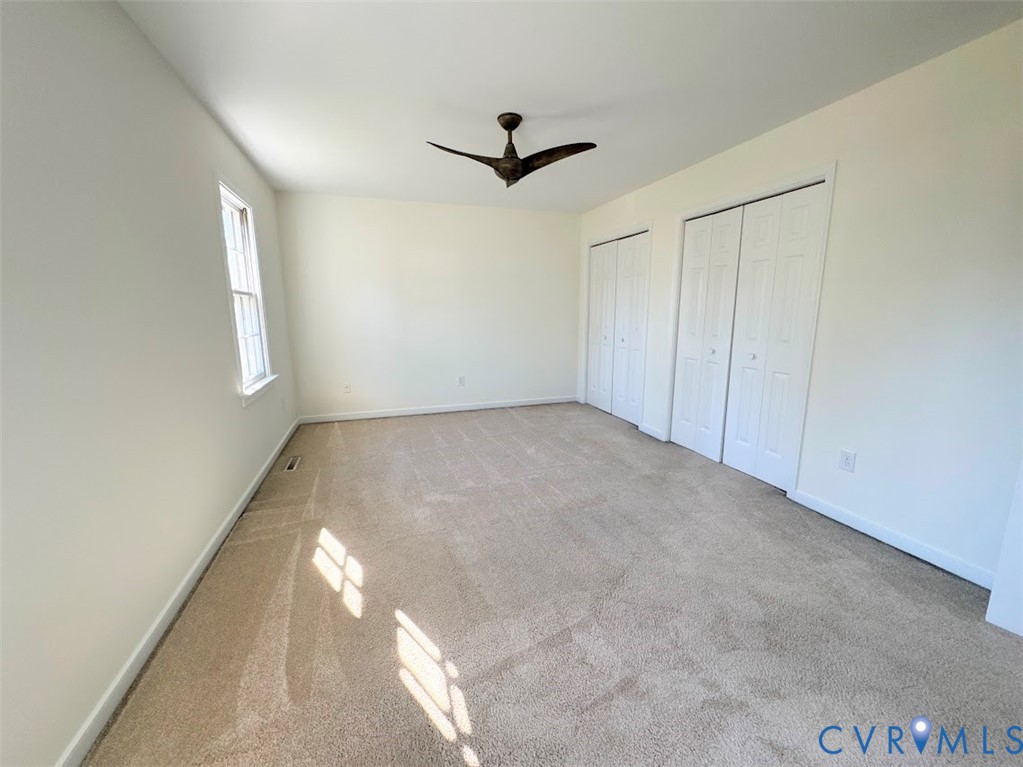1316 Ware Road Henrico, VA 23229 - Photo 11 of 19 Unfurnished bedroom featuring multiple closets, li