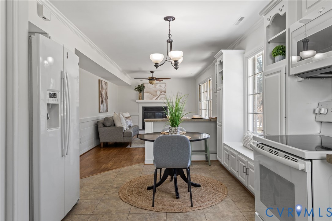 1316 Ware Road Henrico, VA 23229 - Photo 19 of 51 a view of a dining room with furniture window and wooden floor