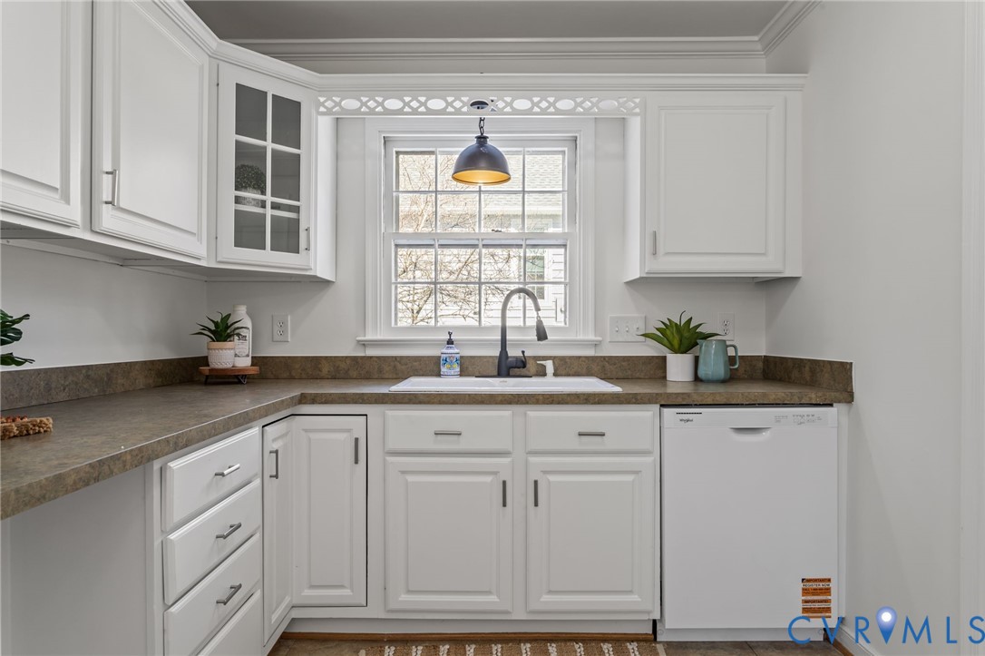 1316 Ware Road Henrico, VA 23229 - Photo 22 of 51 a kitchen with granite countertop white cabinets and window