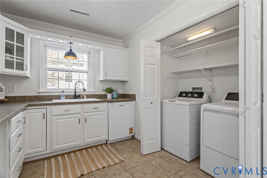 1316 Ware Road Henrico, VA 23229 - Photo 23 of 51 a kitchen with sink cabinets and window
