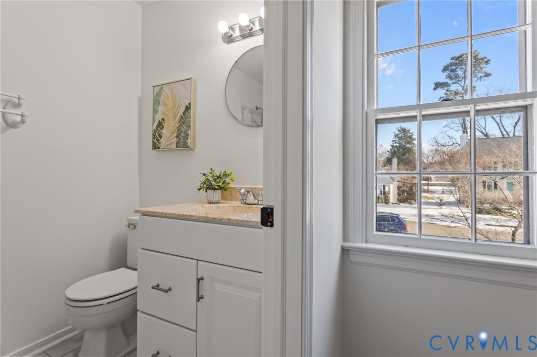 1316 Ware Road Henrico, VA 23229 - Photo 27 of 51 a bathroom with a toilet a sink and a window