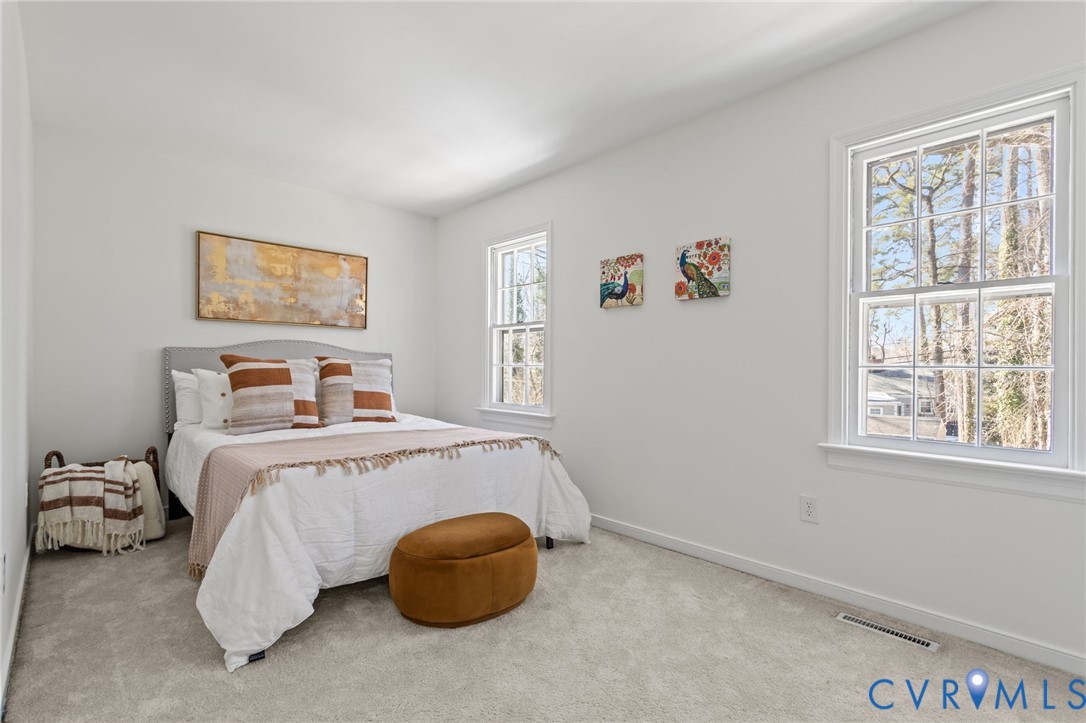 1316 Ware Road Henrico, VA 23229 - Photo 30 of 51 a bedroom with a bed and a window