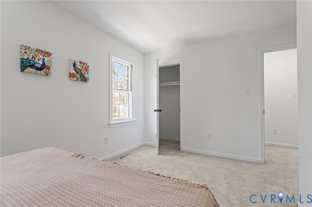 1316 Ware Road Henrico, VA 23229 - Photo 31 of 51 a bedroom with a bed and a window