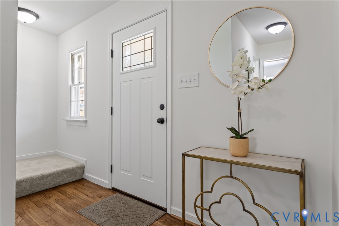 1316 Ware Road Henrico, VA 23229 - Photo 6 of 51 a bathroom with a sink a mirror and a shower