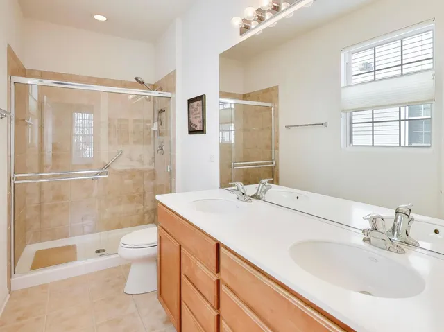 a view of game room with window and air hockey table