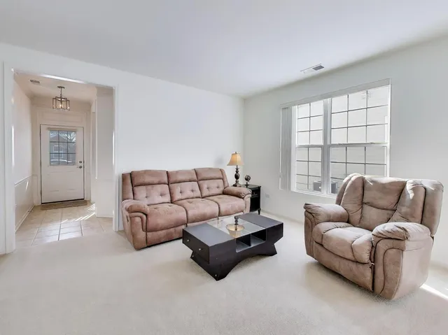 a bedroom with bed and window