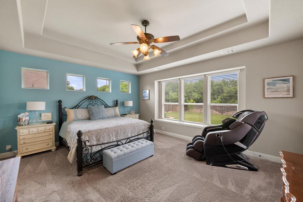 445 Rusty Run Drive Midlothian, TX 76065 - Photo 24 of 40 a spacious bedroom with a bed and glass window