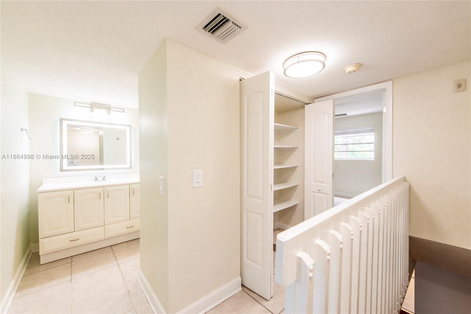 4600 Southwest 67th Avenue, Unit 237 Miami, FL 33155 - Photo 11 of 18 a view of walk in closet with window
