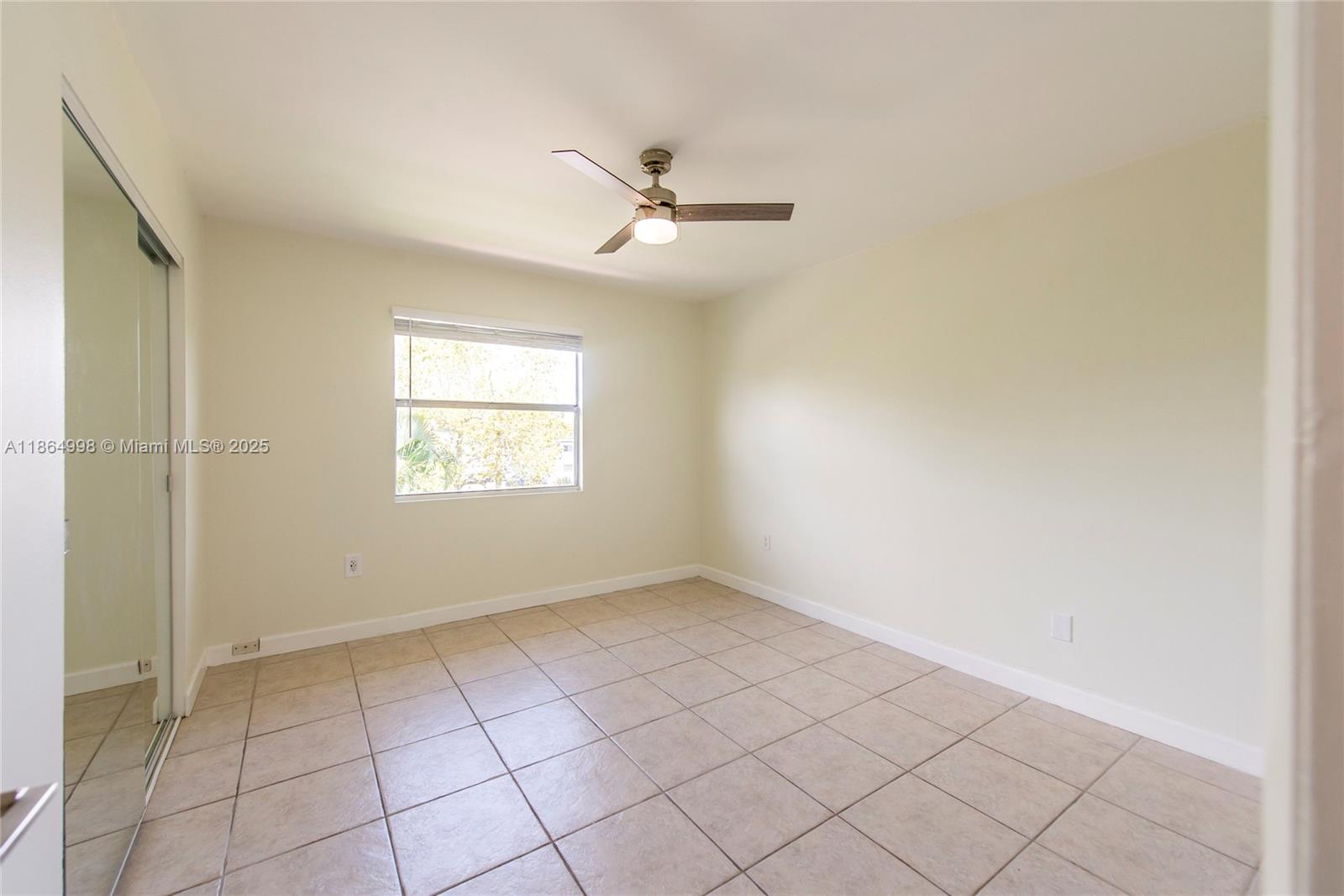 4600 Southwest 67th Avenue, Unit 237 Miami, FL 33155 - Photo 14 of 18 a view of an empty room with a window