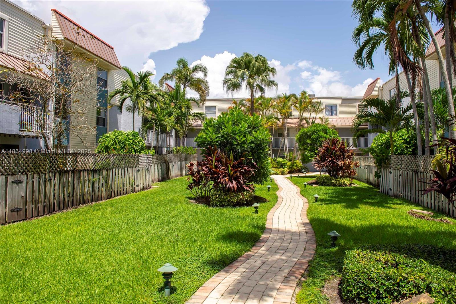 4600 Southwest 67th Avenue, Unit 237 Miami, FL 33155 - Photo 16 of 18 a view of a garden with a fountain