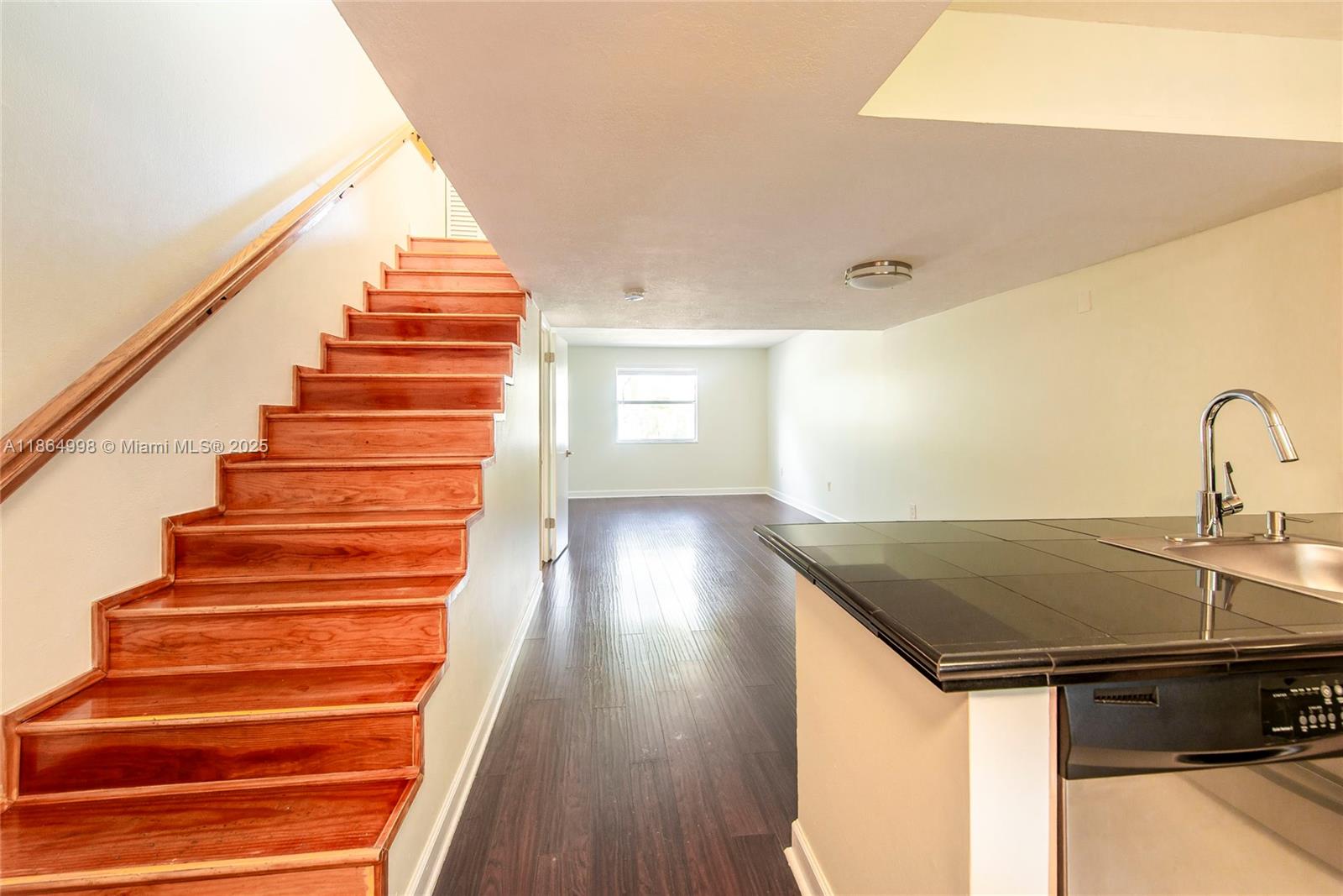 4600 Southwest 67th Avenue, Unit 237 Miami, FL 33155 - Photo 9 of 18 a view of entryway and hall with wooden floor