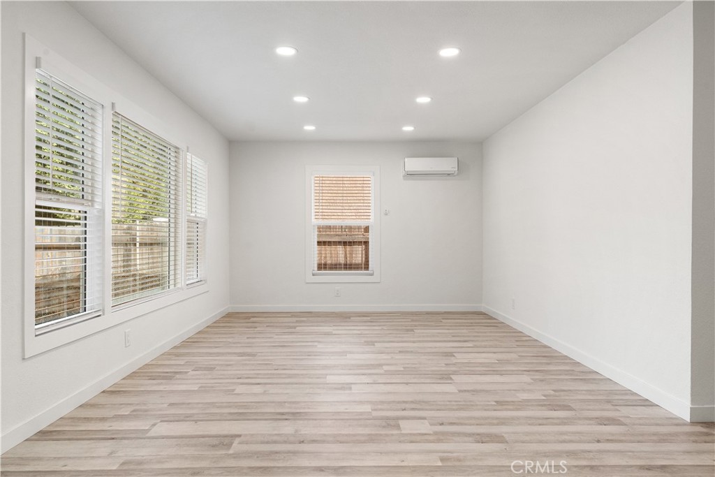 2234 South Standard Avenue Santa Ana, CA 92707 - Photo 20 of 30 a view of empty room with wooden floor and fan