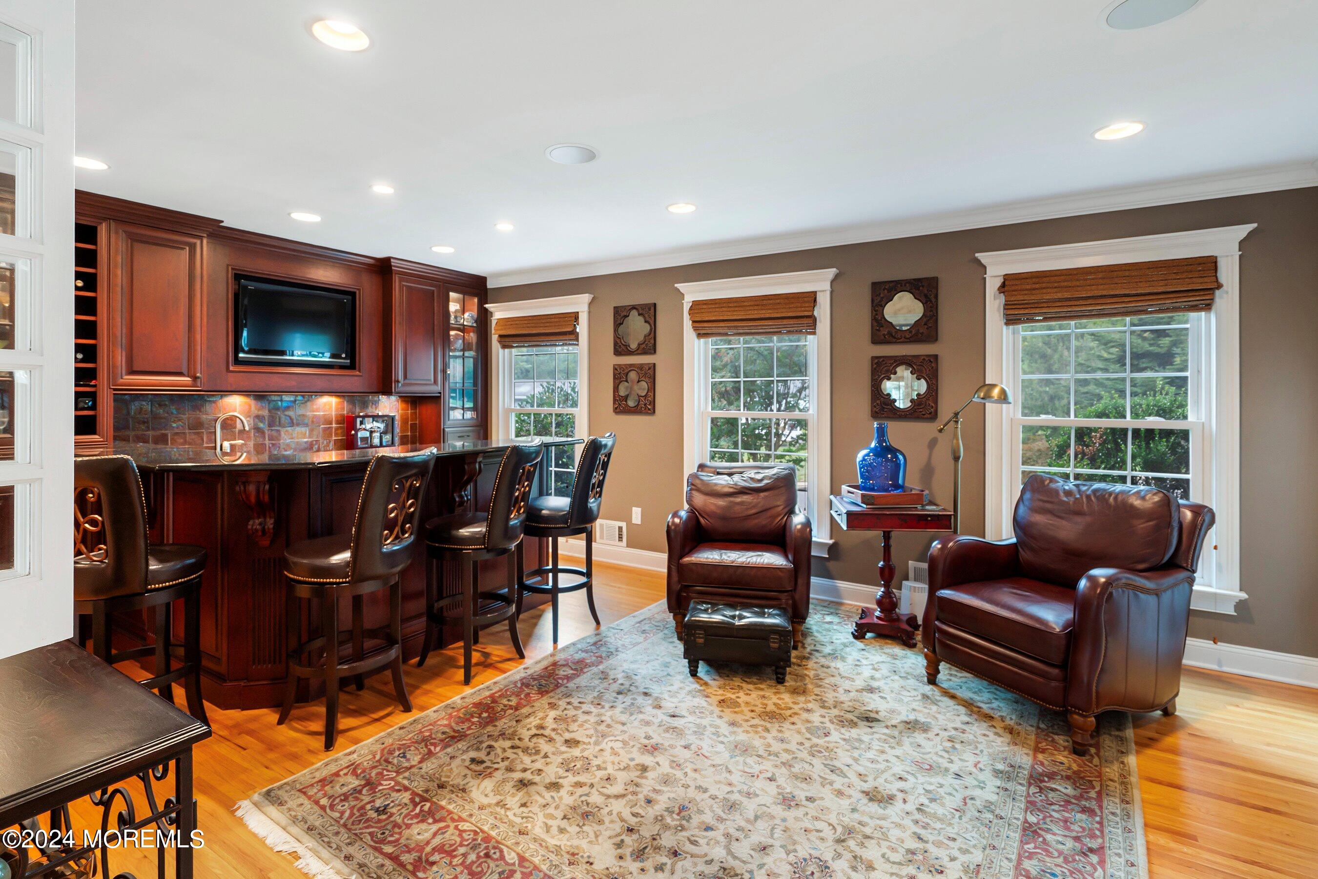 15 Doherty Drive Middletown, NJ 07748 - Photo 22 of 55 a living room with furniture and a flat screen tv