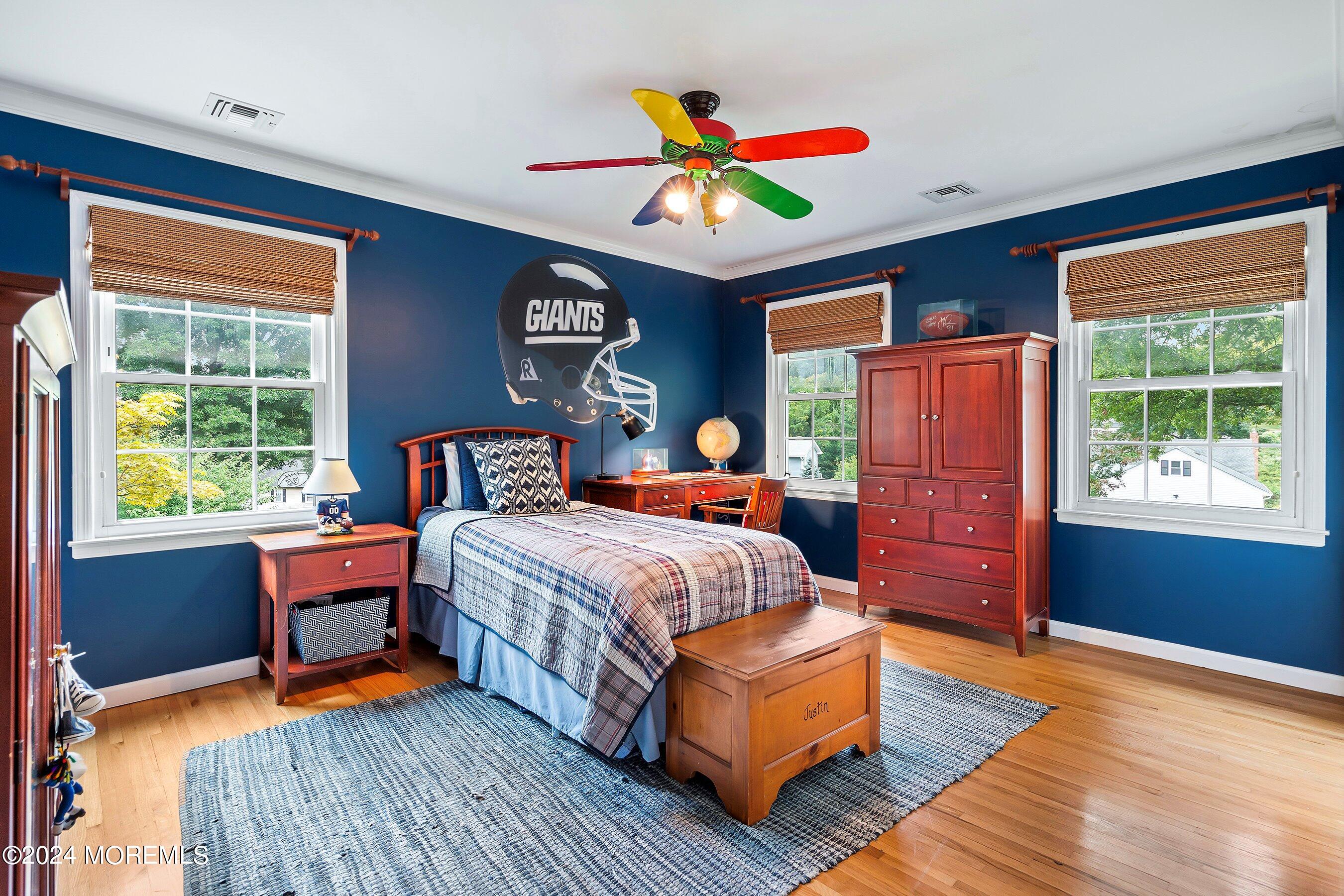 15 Doherty Drive Middletown, NJ 07748 - Photo 36 of 55 a bedroom with a bed and wooden floor