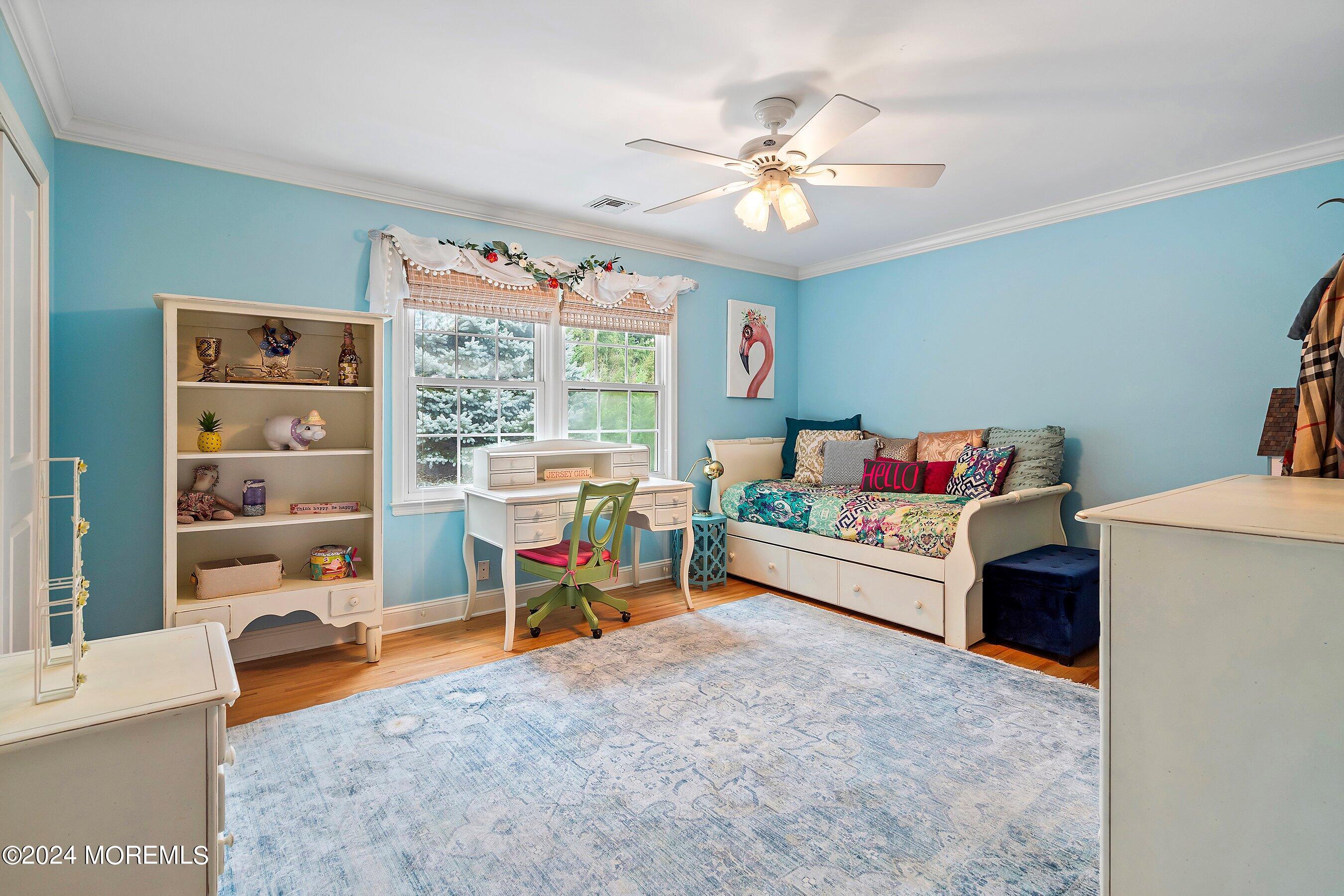 15 Doherty Drive Middletown, NJ 07748 - Photo 37 of 55 a bedroom with a bed and a chandelier