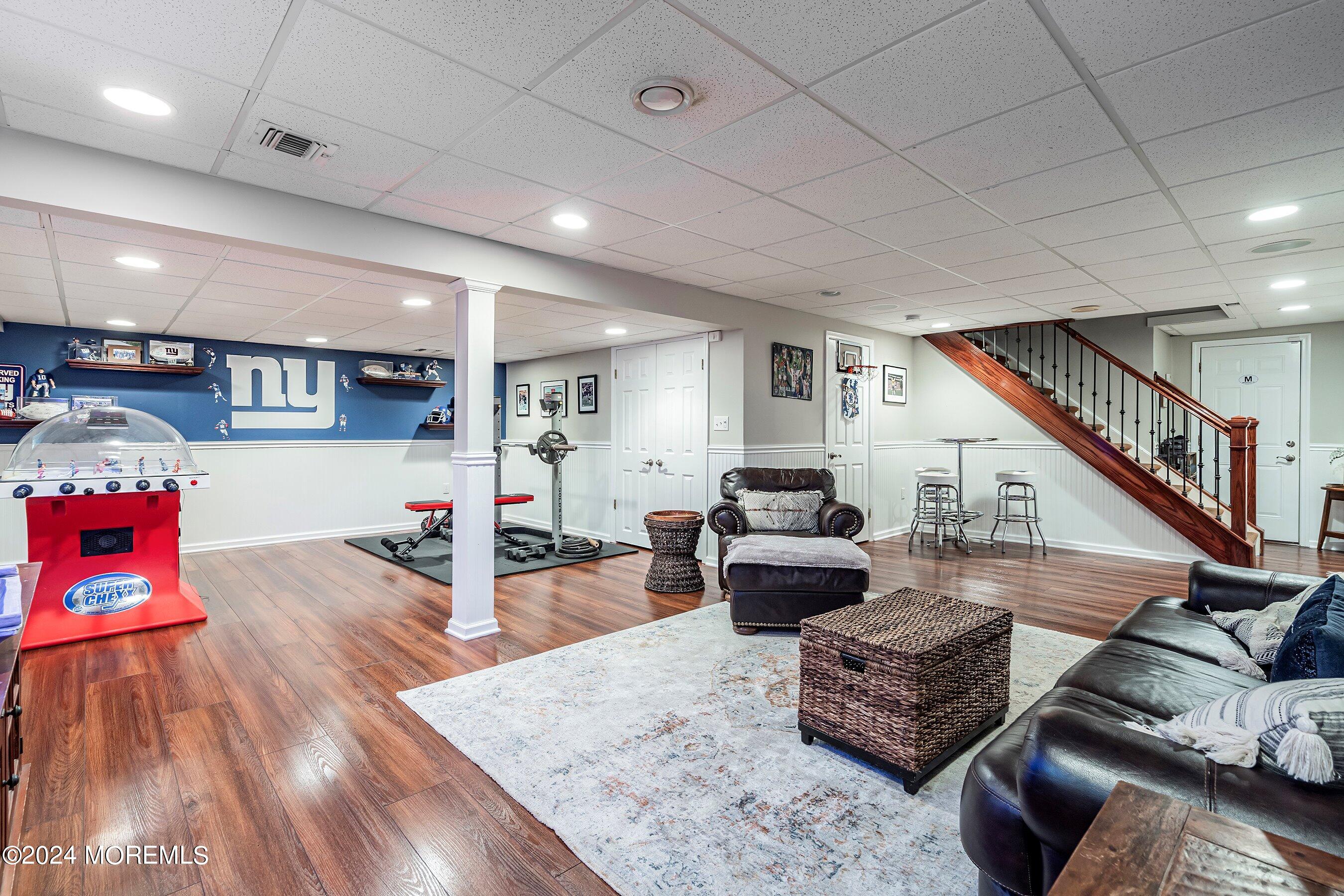 15 Doherty Drive Middletown, NJ 07748 - Photo 41 of 55 a living room with furniture and wooden floor