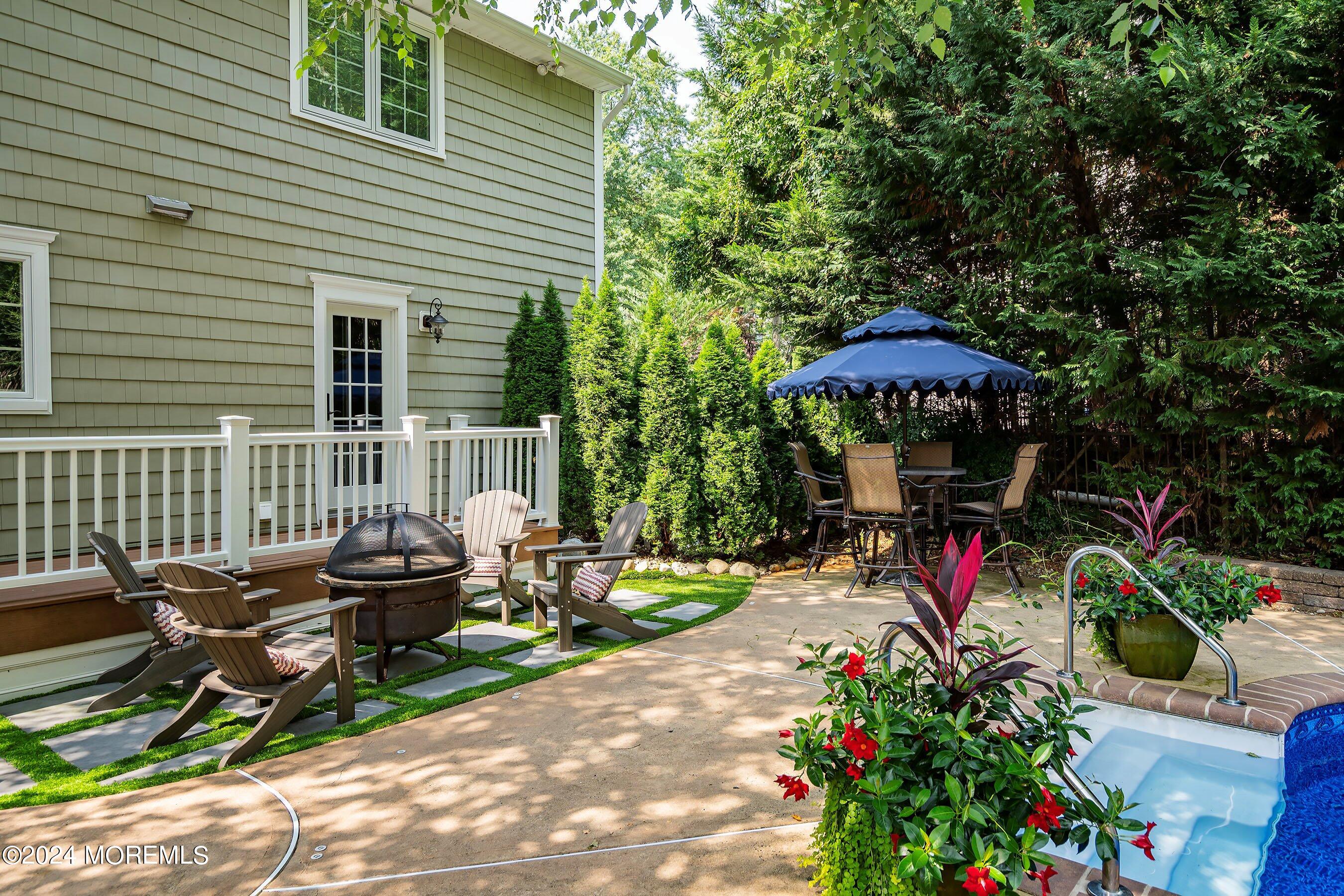 15 Doherty Drive Middletown, NJ 07748 - Photo 44 of 55 a view of a chairs and table in backyard of the house