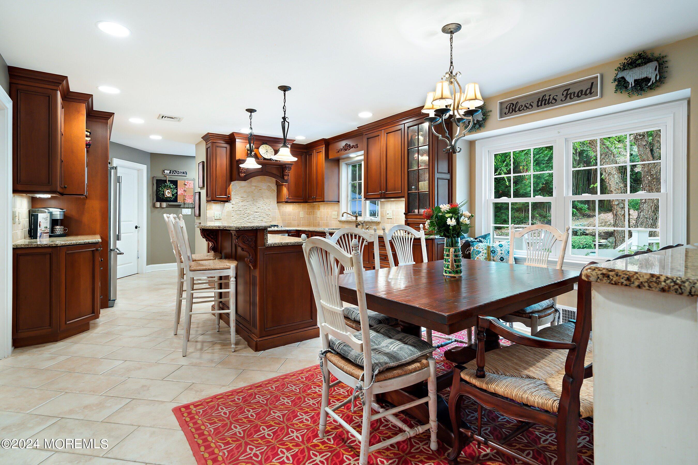 15 Doherty Drive Middletown, NJ 07748 - Photo 9 of 55 a view of a dining room with furniture window and outside view