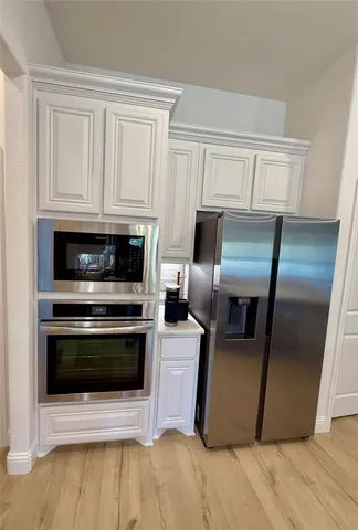 a view of kitchen with furniture and window