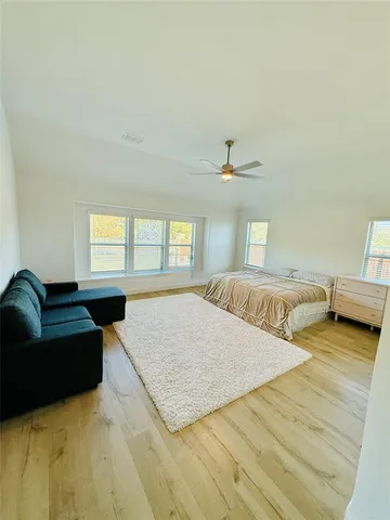 a kitchen with stainless steel appliances granite countertop wooden cabinets a sink dishwasher a stove and a refrigerator