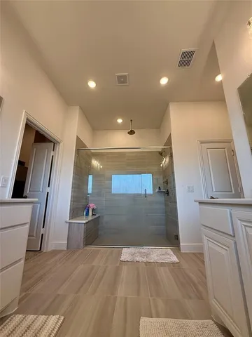 a room with gym equipment and a flat screen tv