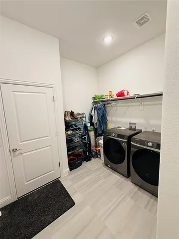 a bathroom with a sink mirror toilet and shower