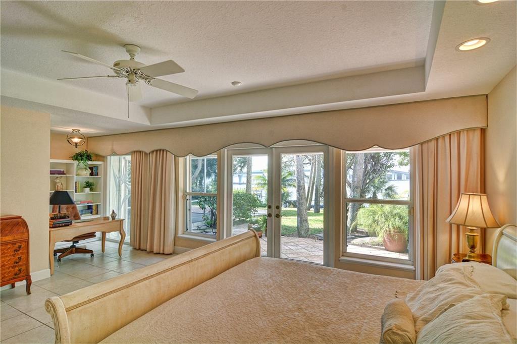 11 North River Road Stuart, FL 34996 - Photo 11 of 31 a living room with furniture and a large window