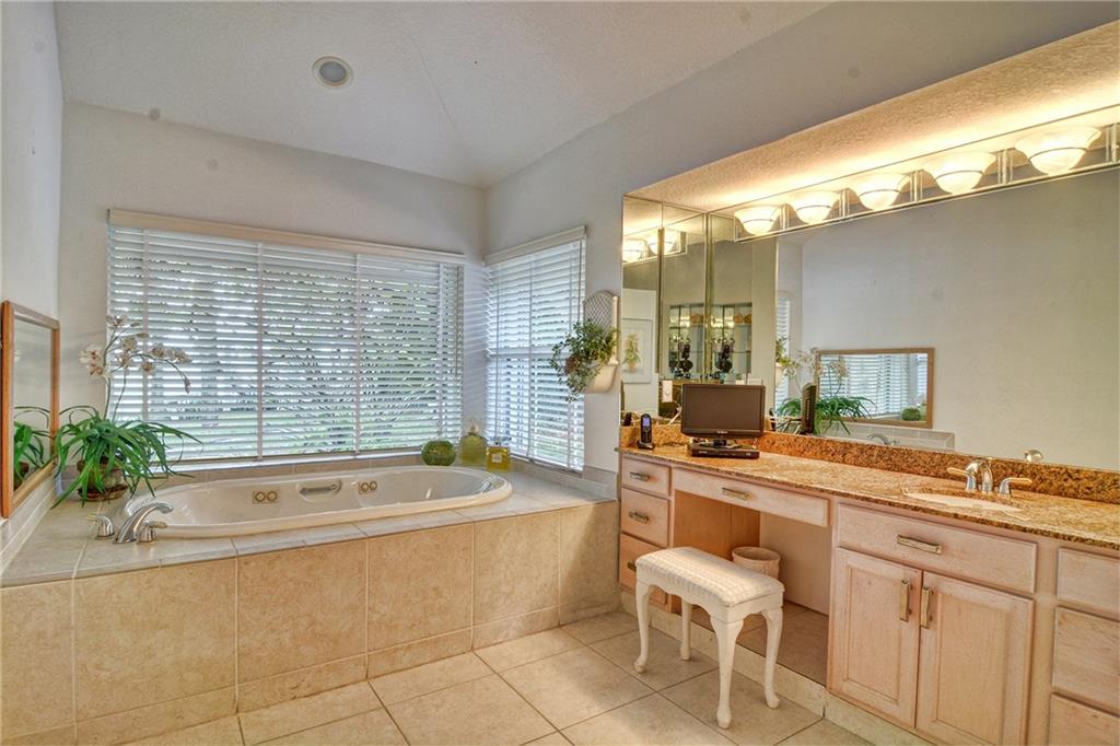 11 North River Road Stuart, FL 34996 - Photo 13 of 31 a bathroom with a bathtub and a sink