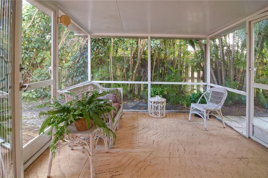 11 North River Road Stuart, FL 34996 - Photo 17 of 31 a view of a chair and tables in the garden