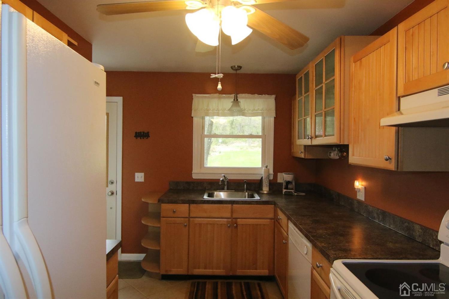 Andersen Andersen Road Bloomsbury, NJ 08804 - Photo 11 of 21 a kitchen with granite countertop a stove a sink and a microwave