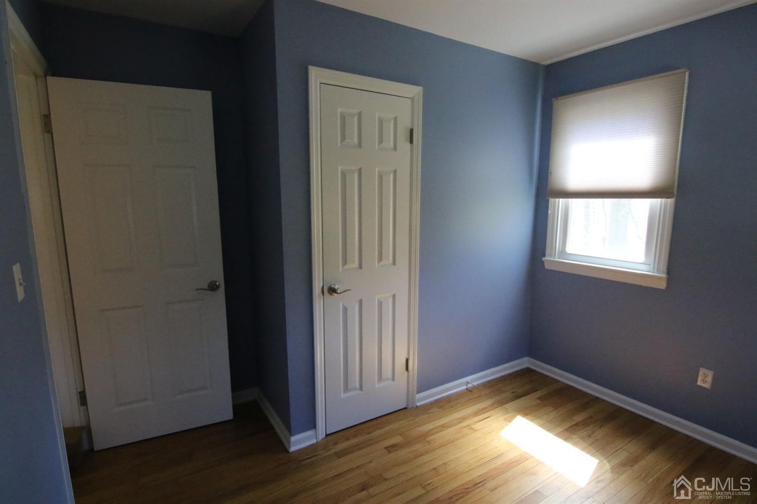 Andersen Andersen Road Bloomsbury, NJ 08804 - Photo 15 of 21 an empty room with wooden floor closet and windows