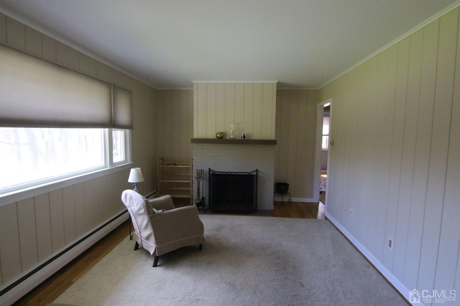 Andersen Andersen Road Bloomsbury, NJ 08804 - Photo 9 of 21 a living room with furniture and a fireplace