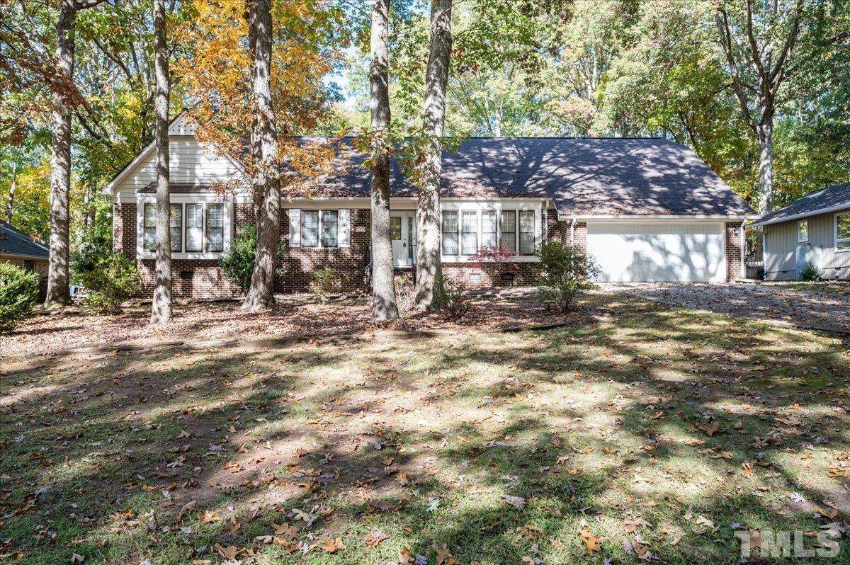 104 Dabney Road Cary, NC 27511 - Photo 1 of 35 a view of a street with a building in the background