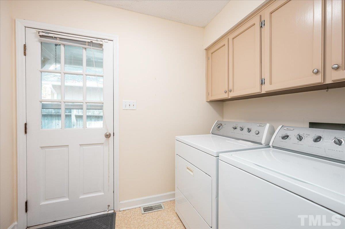 104 Dabney Road Cary, NC 27511 - Photo 16 of 35 a utility room with dryer and washer