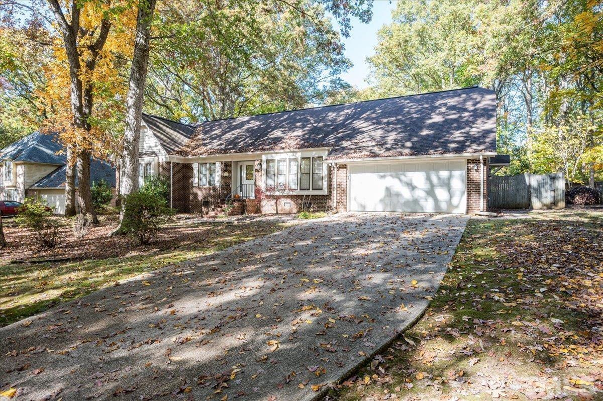 104 Dabney Road Cary, NC 27511 - Photo 2 of 35 a front view of a house with a yard