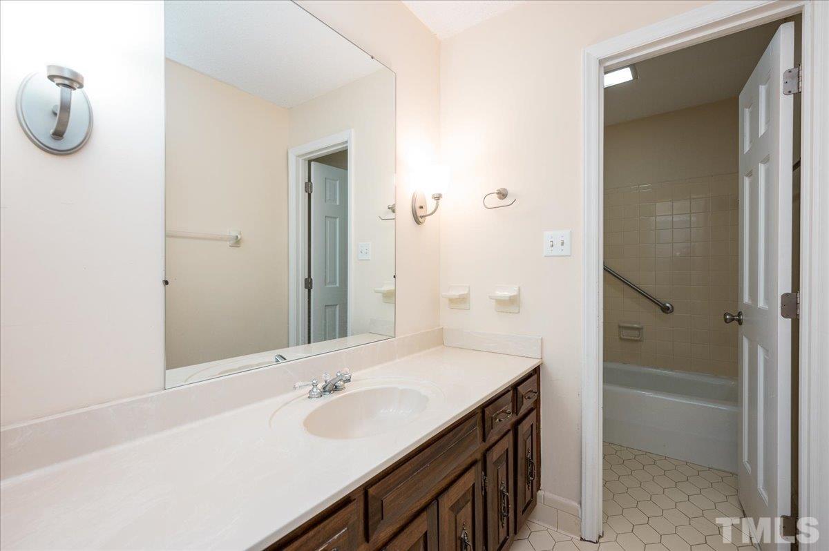 104 Dabney Road Cary, NC 27511 - Photo 30 of 35 a bathroom with a sink and a mirror