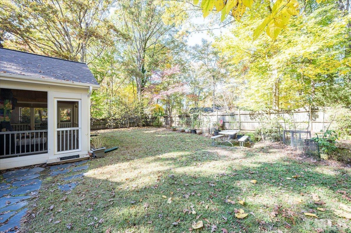 104 Dabney Road Cary, NC 27511 - Photo 33 of 35 a view of a house with backyard and a tree