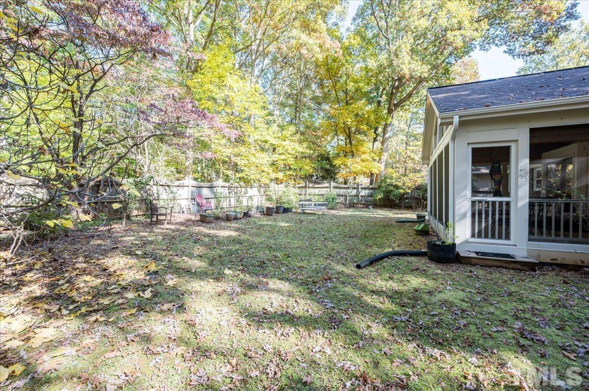104 Dabney Road Cary, NC 27511 - Photo 35 of 35 a view of a house with backyard and a tree