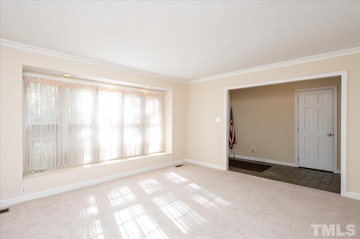104 Dabney Road Cary, NC 27511 - Photo 8 of 35 a view of an empty room with a window