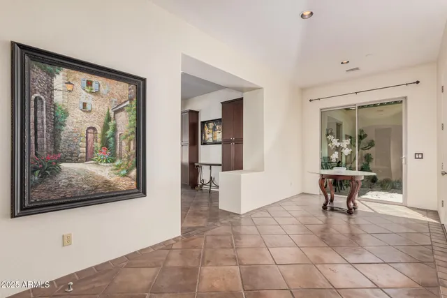 a living room with furniture and a painting