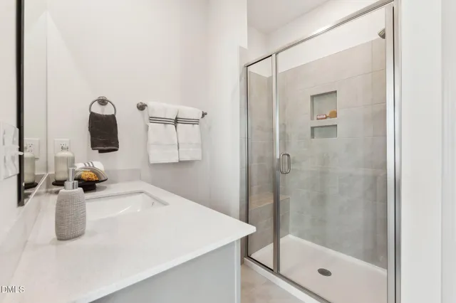 a bathroom with a sink and mirror